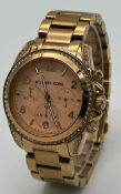 A MICHAEL KORS, ROSE GOLD, STONE SET, DATE FUNCTION, BRACELET WATCH. ORIGINAL BOX, PAPERS AND