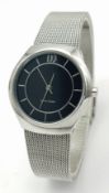 A DANISH DESIGN, STEEL MESH BRACELET WATCH. IN FULL WORKING ORDER. EXCELLENT CONDITION. NEW