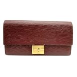 A Mulberry Burgundy Leather Long Wallet. Burgundy leather exterior with gold-tone hardware and