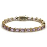 A Pretty Gold Gilded Sterling Silver and Amethyst Set Tennis Bracelet-19.5cm Length. Set with