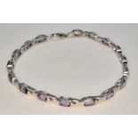 A Pretty Sterling Silver and Amethyst Set Tennis Bracelet-19cm Length. Set with Seventeen 7mm Long