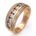 A 10K Channel Set Diamond Half Eternity Ring. 0.45ctw of round brilliant cut diamonds having K