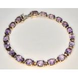 An Attractive Sterling Silver and Amethyst Set Tennis Bracelet-19cm Length. Set with Twenty 6 x