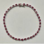 A Pretty Sterling Silver and Ruby Set Tennis Bracelet-19.5cm Length. Set with Thirty-Seven 3mm Round