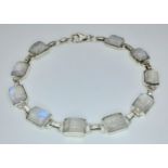 An Elegant Sterling Silver Moonstone Set Tennis Bracelet-20.5cm Overall Length. Set with Ten 9 x 7mm