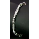A 14K WHITE GOLD, BAGUETTE CUT, DIAMOND SET, TENNIS BRACELET. 0.50TCW, 10.7G. SC 5029