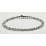 A W.G.I. Certified 14K White Gold and Diamond Tennis Bracelet. 53 round brilliant cut diamonds of