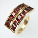 An 18K Yellow Gold Articulated Two Row Garnet Ring by Garrard. Hallmarked 750 GARRARD. Total