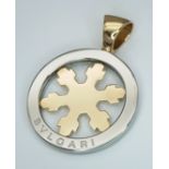 An 18K Yellow Gold and Stainless Steel Bvlgari Tondo Snowflake Pendant. Openwork gold snowflake