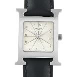 A Hermes Heure H Steel Quartz Watch. ref. HH1.201. H-shaped case with a white dial detailed with