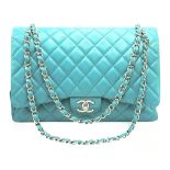 A Tiffany Blue Chanel Jumbo Classic Double Flap Bag. Quilted Tiffany blue leather exterior with