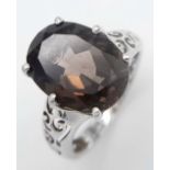 Impressive SILVER and SMOKEY QUARTZ RING. Consisting a large OVAL CUT SMOKEY QUARTZ GEMSTONE set