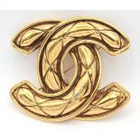 A Chanel gold-tone fashion brooch. In good condition.