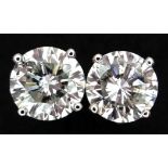 A Pair of 18K White Gold Diamond Stud Earrings. c.1.45ctw of round brilliant cut diamonds having G