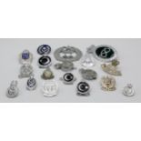 A collection of 18 Worldwide Police Cap Badges