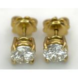 A Pair of 18K Yellow Gold Diamond Stud Earrings. Round cut diamonds circa 1.64ctw. 2.64g total