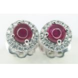 A Pair of 18K White Gold, Ruby Cabochon and Diamond Stud Earrings. 2.5g total weight. MT44.