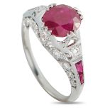 An 18K White Gold 0.18ct Diamond and Ruby Ring. The 18K White Gold setting features a 1.50-carat