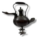 A large antique Japanese Bronze Duck-Form Teapot. Dark bronze exterior with bronze hardware, swing