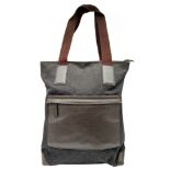 A Gucci GG Canvas Tote Bag. Dark brown GG monogram canvas exterior with brown leather trim, double