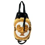 A VERSACE TOTE BAG WITH TIE TOP, SHOULDER STRAP AND IN THE RECOGNISABLE VERSACE PRINT.