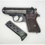 A Deactivated Vintage West German Walther PPK Semi-Automatic Pistol. Black finish with brown checked