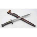 An Antique British Lee Enfield Dagger Bayonet. War department markings. Comes with leather scabbard.