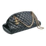 A Chanel Mademoiselle Bowling Bag. Black diamond-quilted leather exterior with gold-tone hardware,