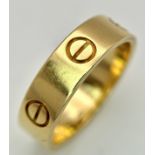 A Classic 18K Yellow Gold Cartier Love Ring. Size 56 (P). 5.5mm width. Cartier markings on inner