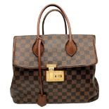 A Louis Vuitton Damier Ebene Ascot Bag. Brown Damier Ebene coated canvas exterior with brown leather
