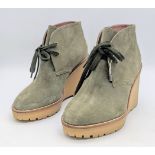 A Pair of REDValentino Olive Green Wedge Ankle Boots. Suede exterior with textile laces and rubber