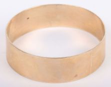 A 9ct bangle, 75mmW, 66.6g
