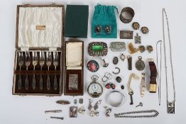 A group of mixed items including silver jewellery, two silver napkin ring, silver bracelet,