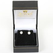 A pair of 18ct diamond stud earrings, totalling 0.5ct, diamonds 5mm, 1.61g, in box