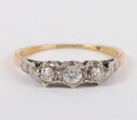 An 18ct gold three stone diamond ring, 2.19g