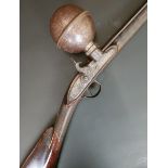 A rare early 19th century ball above barrel air rifle, by Wilson, 117 cm overall    Provenance:
