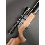 A Theoben Rapid 7 .22 air rifle, 1117, with a Tasco scope, 97 cm overall    Provenance: The property