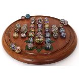 A late 19th/early 20th century solitaire board, the reverse with printed labels, The Improved Game