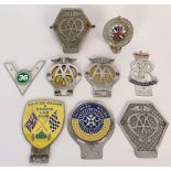 Two AA commercial badges, and other assorted car and motorcycle badges