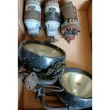 A pair of Lucas black painted headlamps, on iron brackets, and three magneto's (conditions
