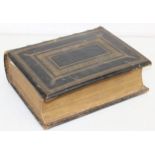 A large 19th century leather bound family Bible by David Davidson, 36cm x 29cm x 11cm