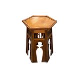 In the manner of Liberty, an Arts & Crafts Moorish inspired hexagonal table, 42cms wide.