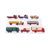A Dinky Supertoys Guy flatbed lorry; together with four similar; a Dinky Supertoys pressure re-