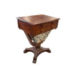 A Victorian mahogany work table, with two frieze drawers and two faux frieze drawers above a well,