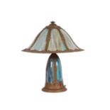 An Art Nouveau gilt metal mounted slag glass panel table lamp, 53cms high.