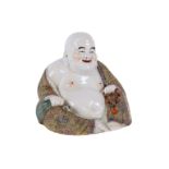A Chinese Republic style famille rose figure of a seated Buddha, 24cms high.