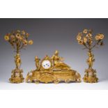 A French gilt bronze three-piece clock garniture with Erato, playful putti and Sèvres style plaques