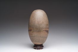 A lingam stone on later wooden base, India, n.d.