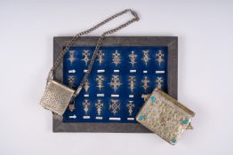 21 silver Tuareg pendants and two Koran boxes in silver and copper, Nigeria, Mali and Morocco, 19th/