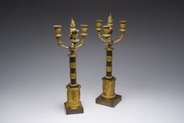 A pair of French Empire gilt and patinated bronze three-light candelabre, 19th C.
